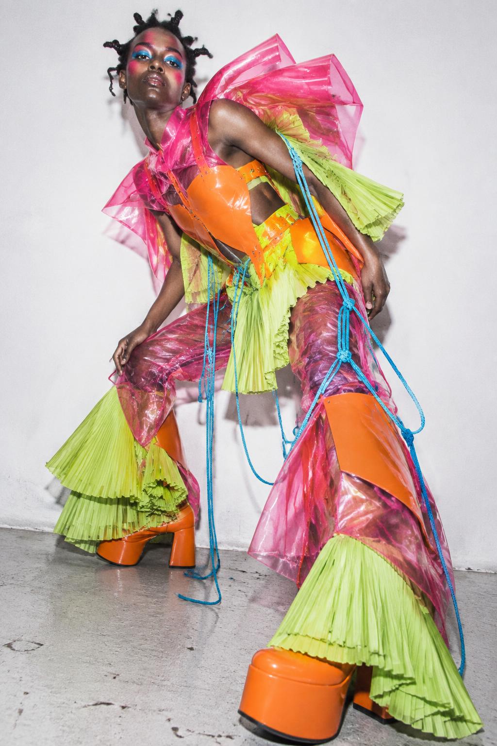 Model wearing a vivid sculptural fashion look