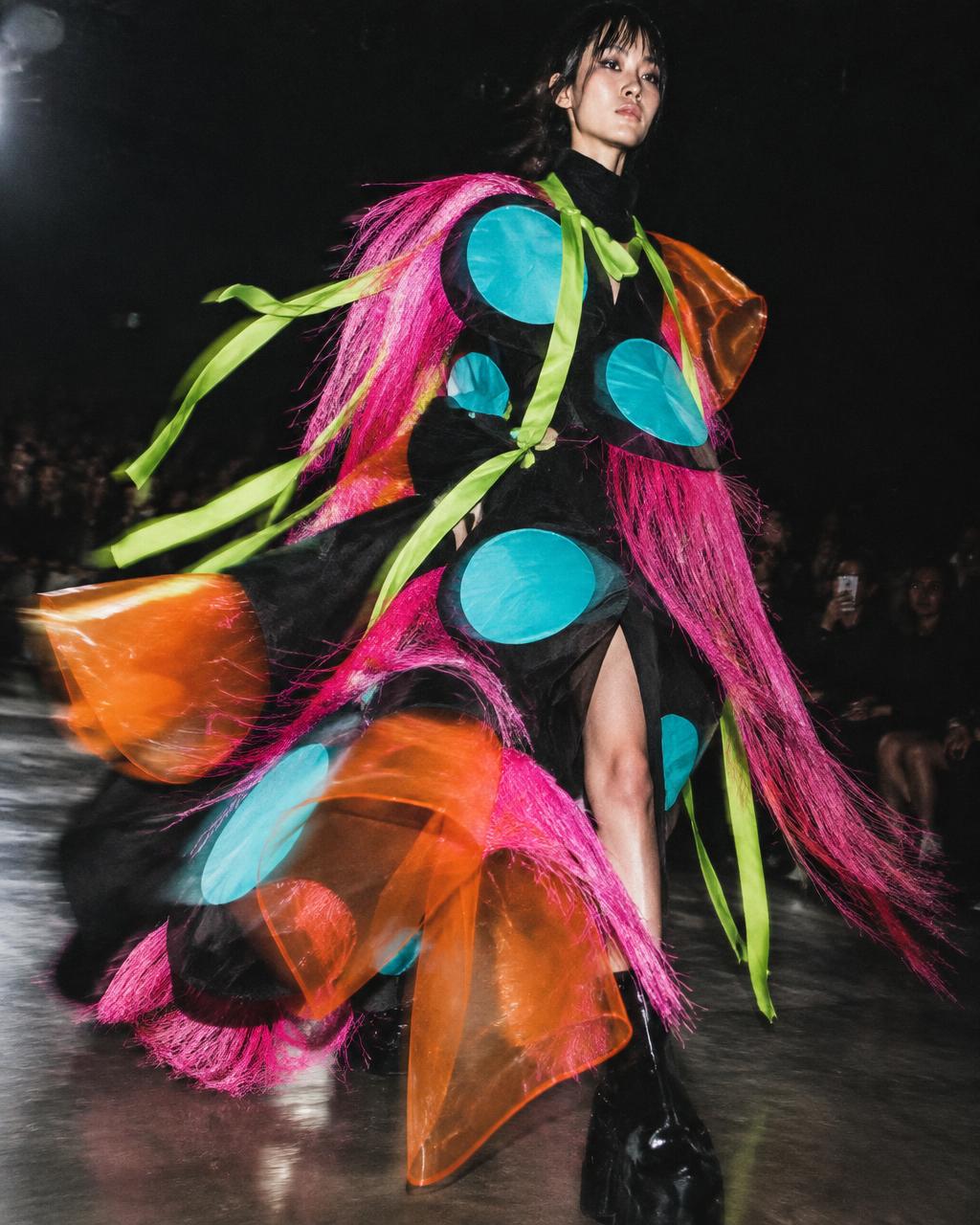 Experimental runway look in vivid moving color